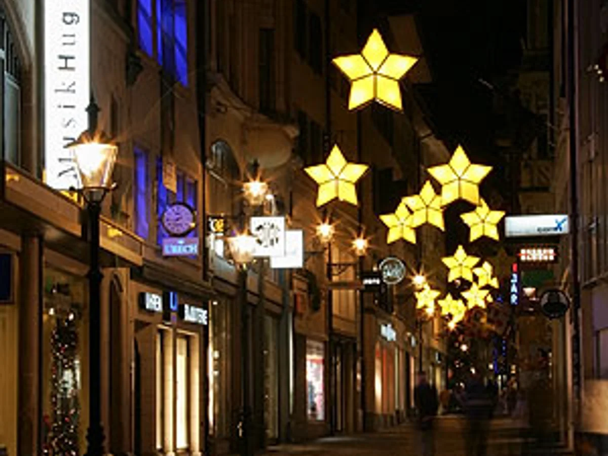 Lucerne historic architecture adorned with golden stars during Christmas season