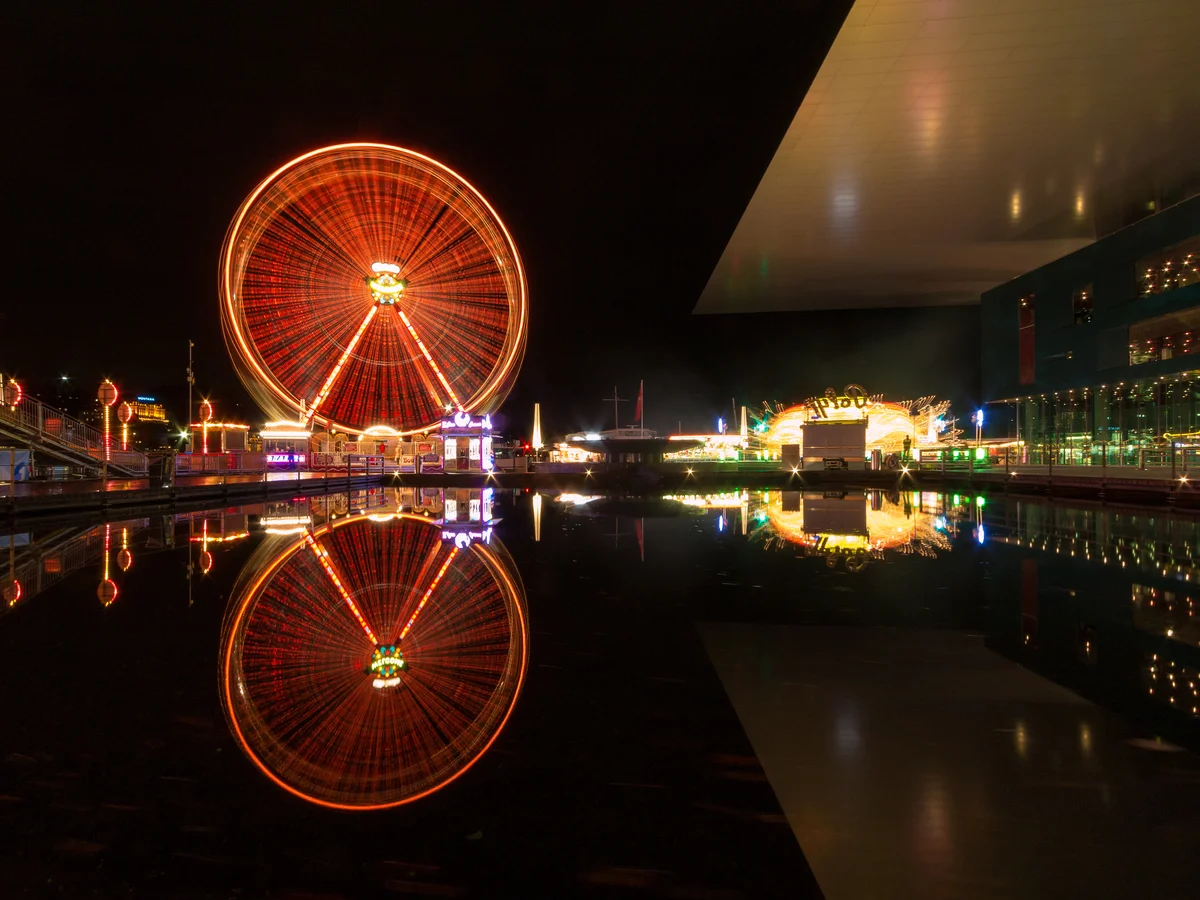 Lucerne's stunning waterfront illuminated at night during winter festivities
