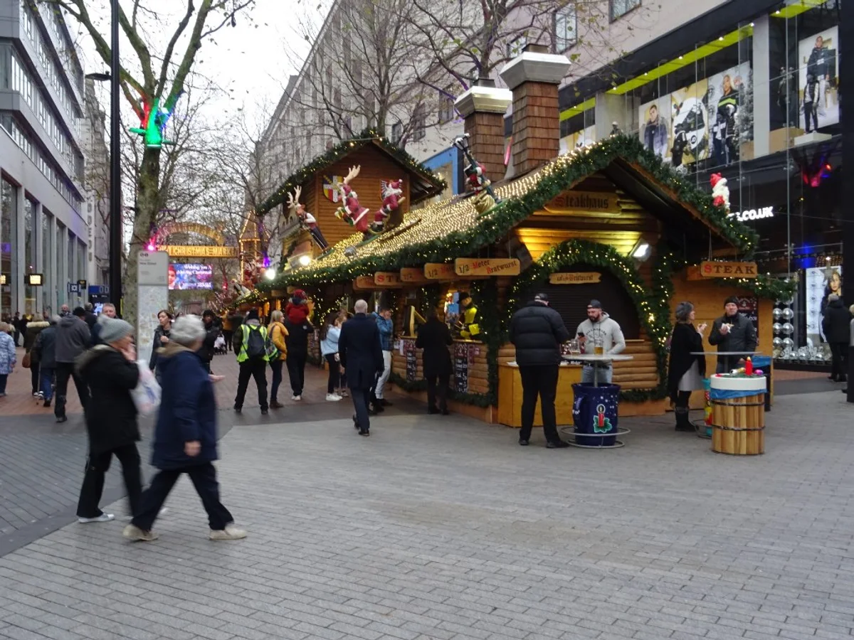Birmingham bustling Christmas market scene with festive decorations