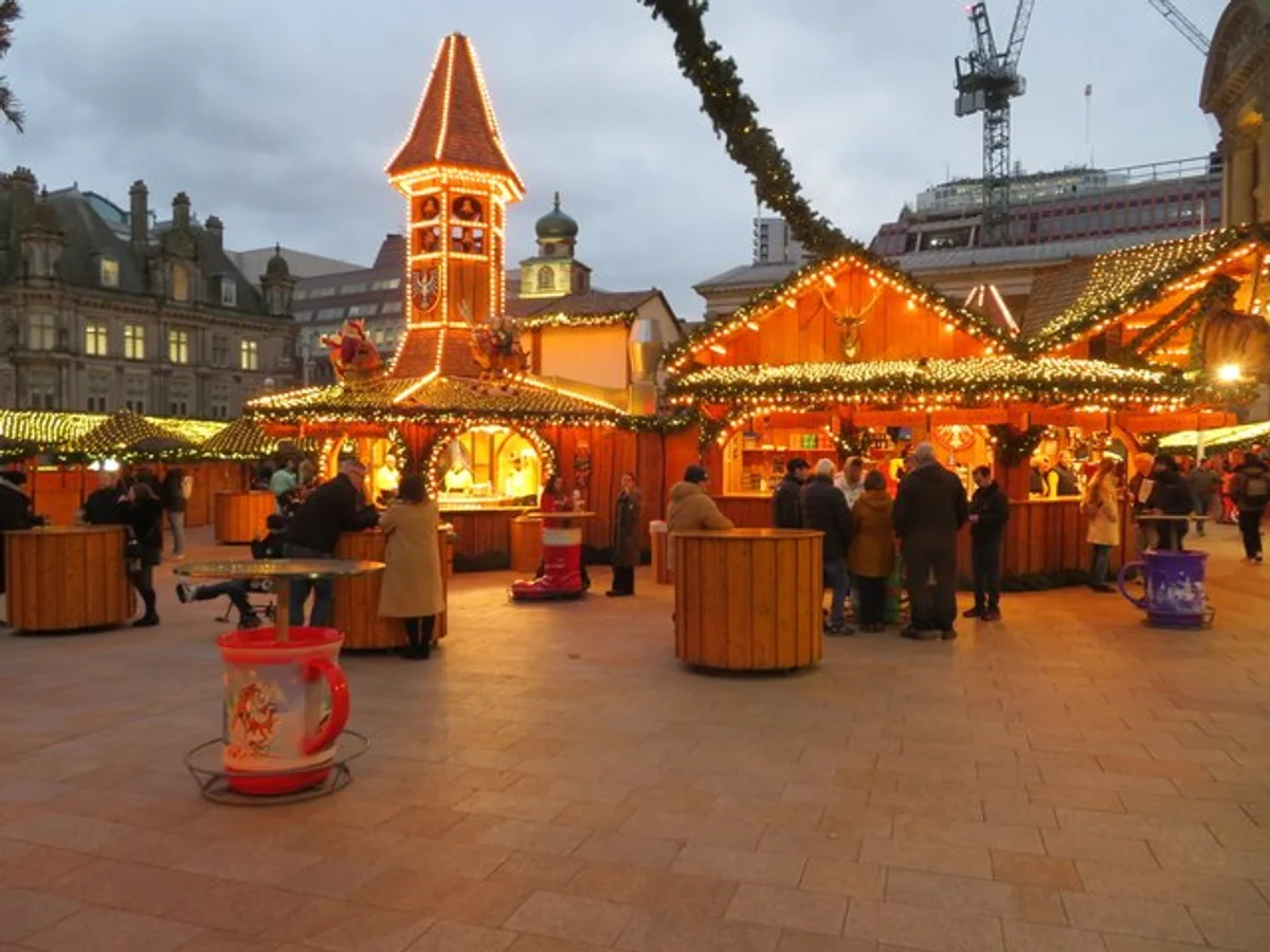 Birmingham festive market scene with warm golden lights during winter