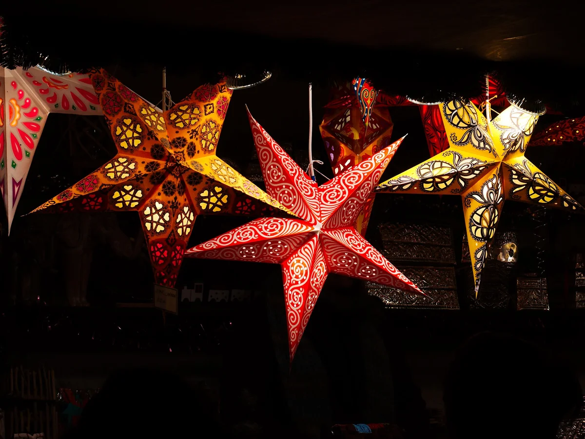 Edinburgh beautifully illuminated with vibrant star lanterns during Christmas season