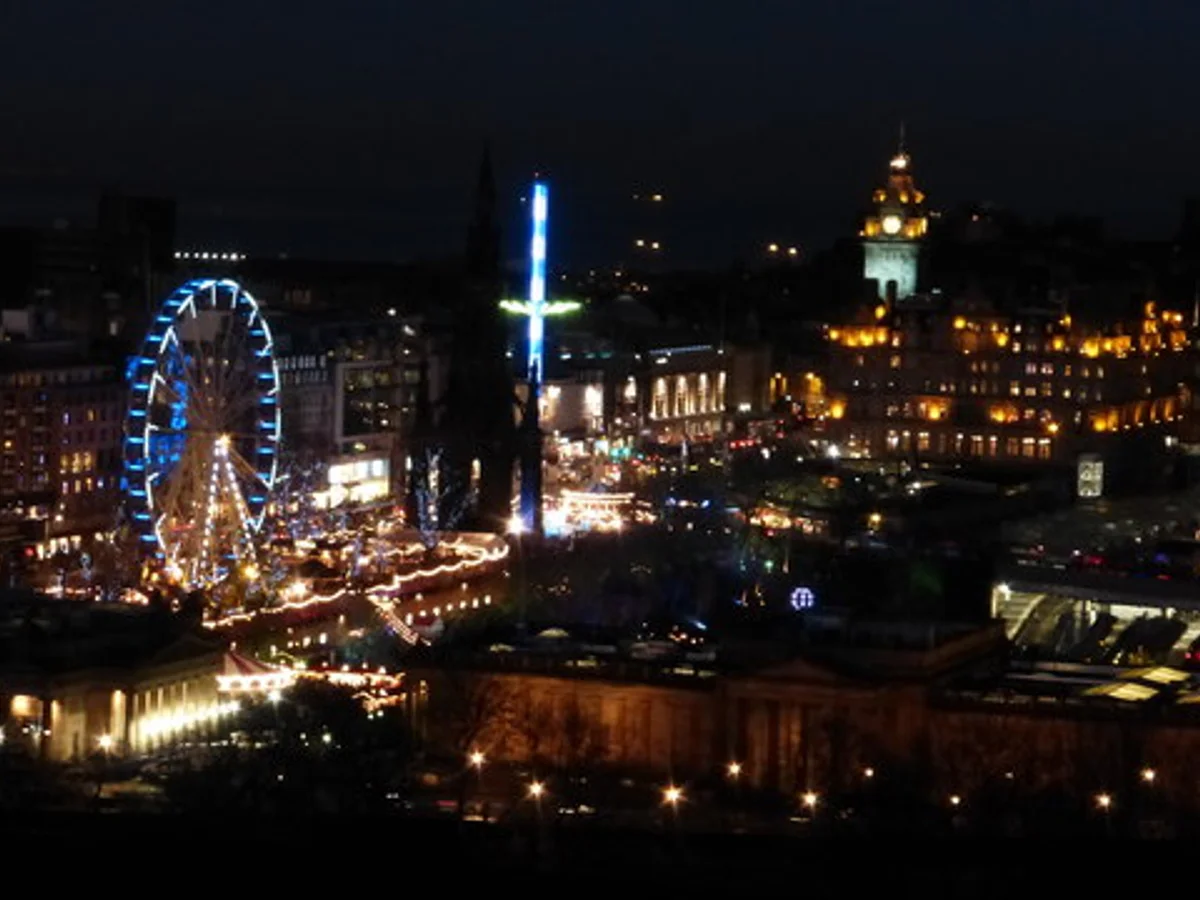 Edinburgh Scott Monument illuminated at twilight during Christmas season