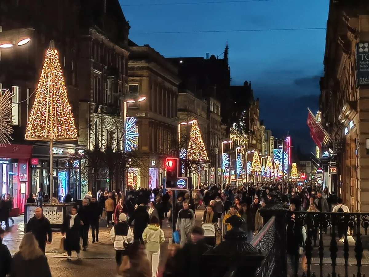 Glasgow golden Christmas trees illuminate Buchanan Street at twilight