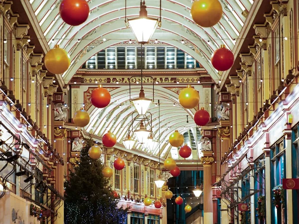 London's Leadenhall Market adorned with red and gold baubles during Christmas